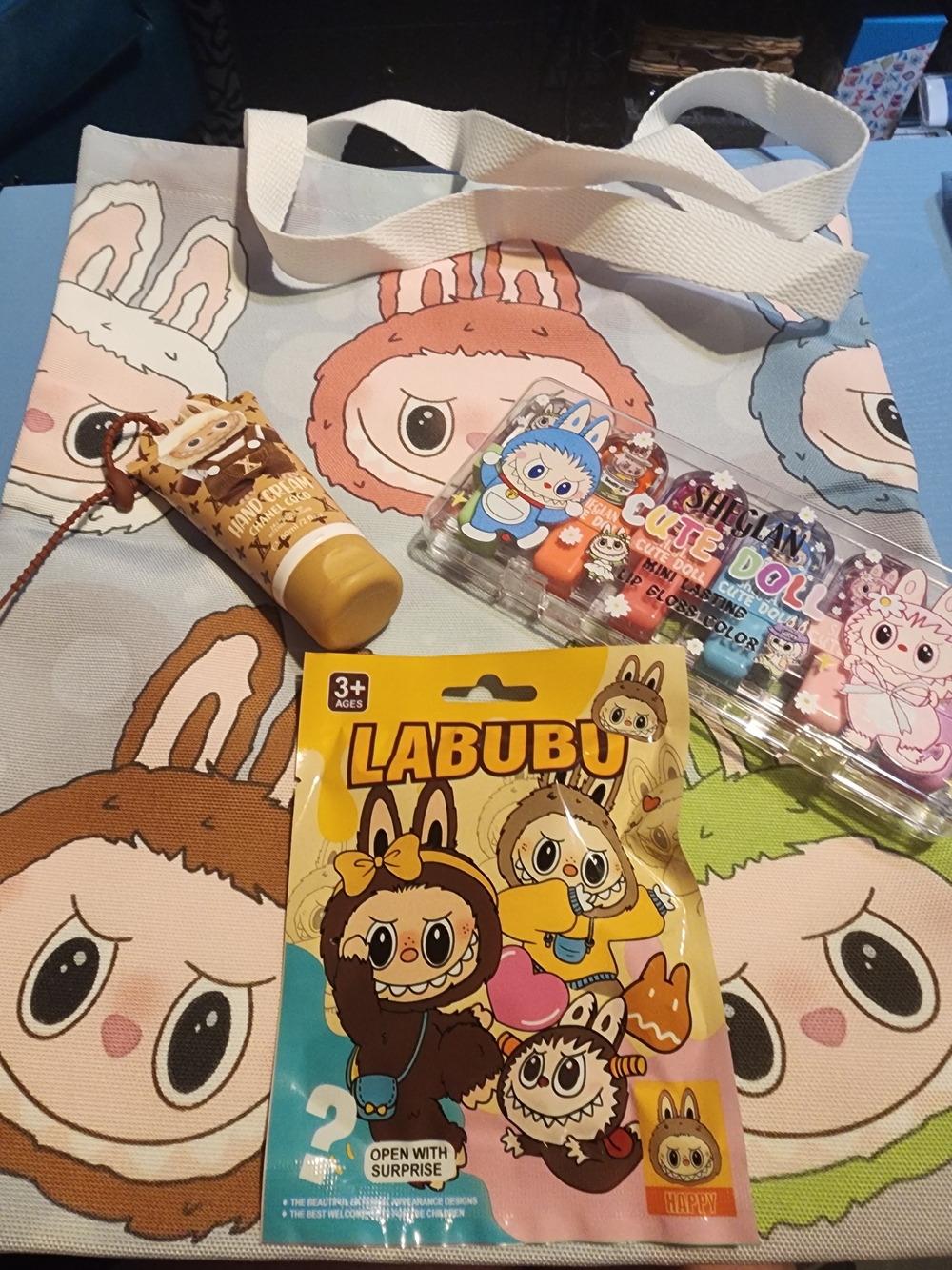 LABUBU Bundle: Tote, Suprise Bag, Hand Cream, Set Of 6 Colorful Lipgloss.
